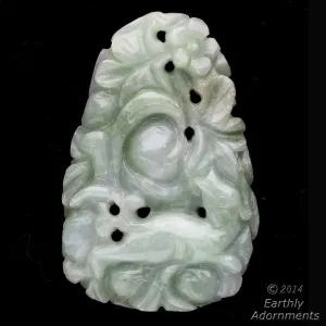 Vintage carved nephrite jade pendant depicting fruit tree and dog. Vintage carved nephrite jade pendant depicting fruit tree and dog.